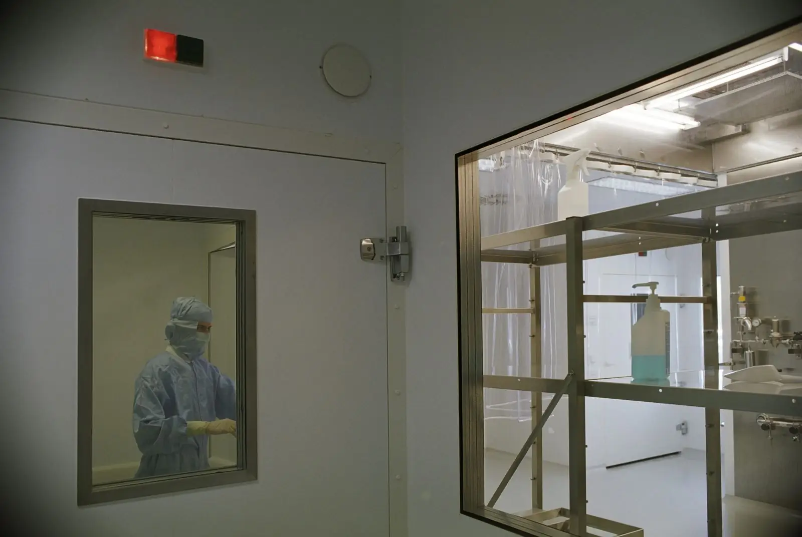 Clean room with flush panel walls and a view window