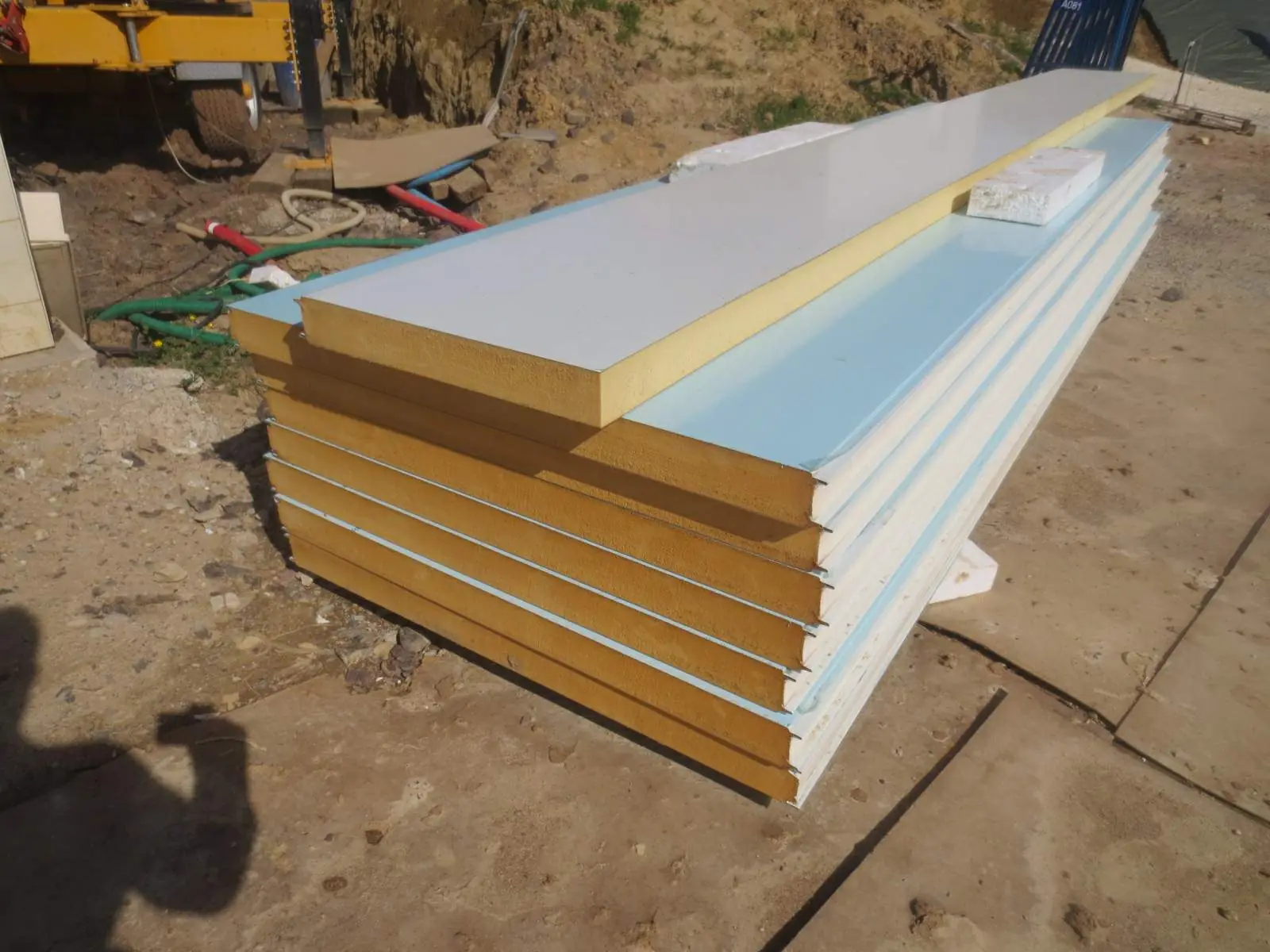 Insulated sandwich panels stacked on a building site