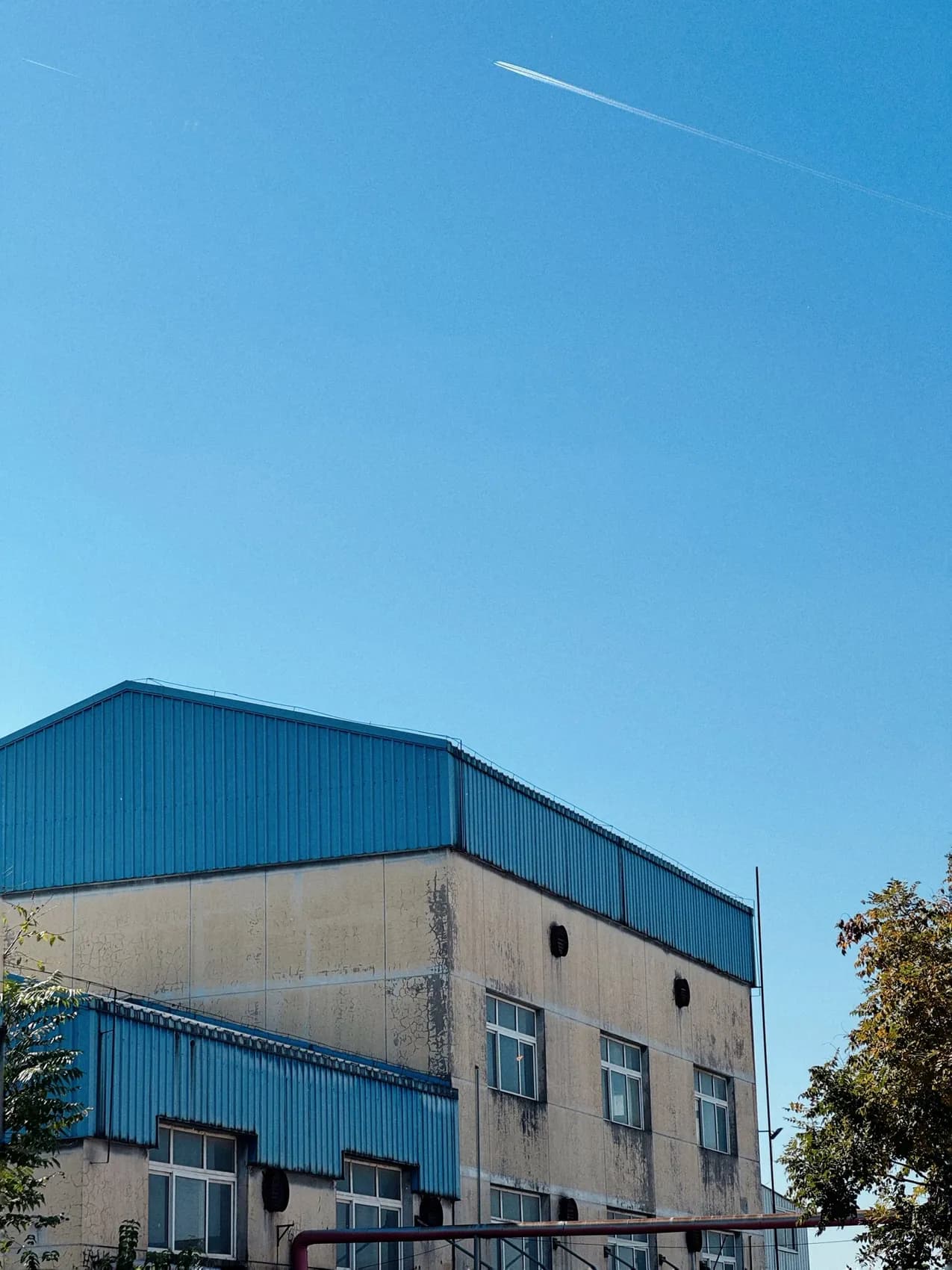 Warehouse with a blue metal panel roof