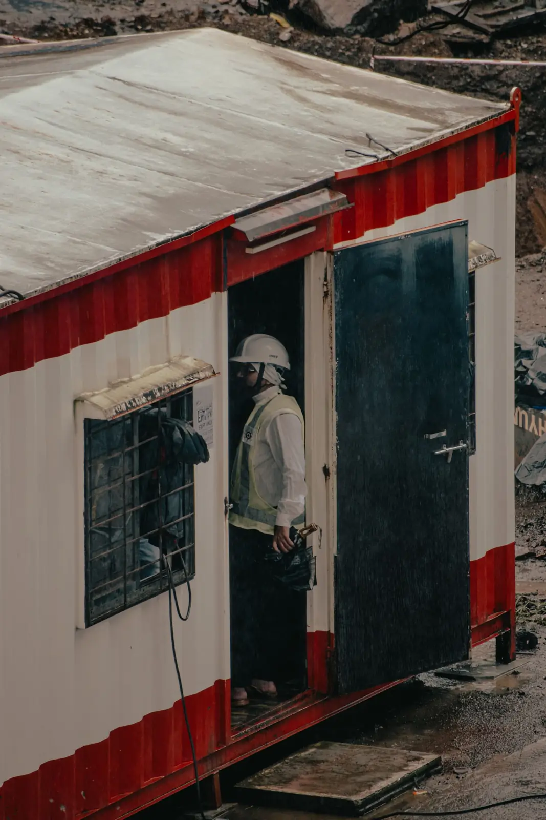 Worker at a prefab site office cabin