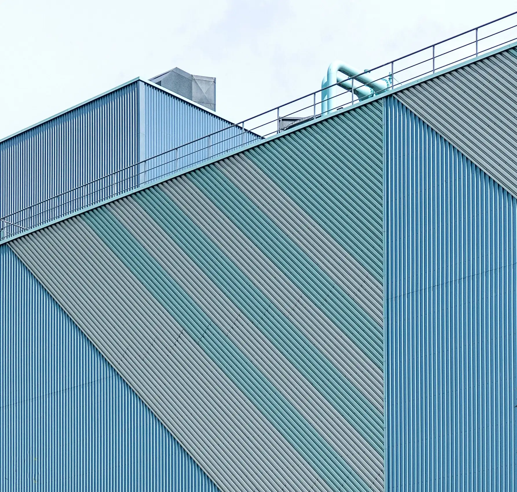 Blue profiled metal wall in diagonal light