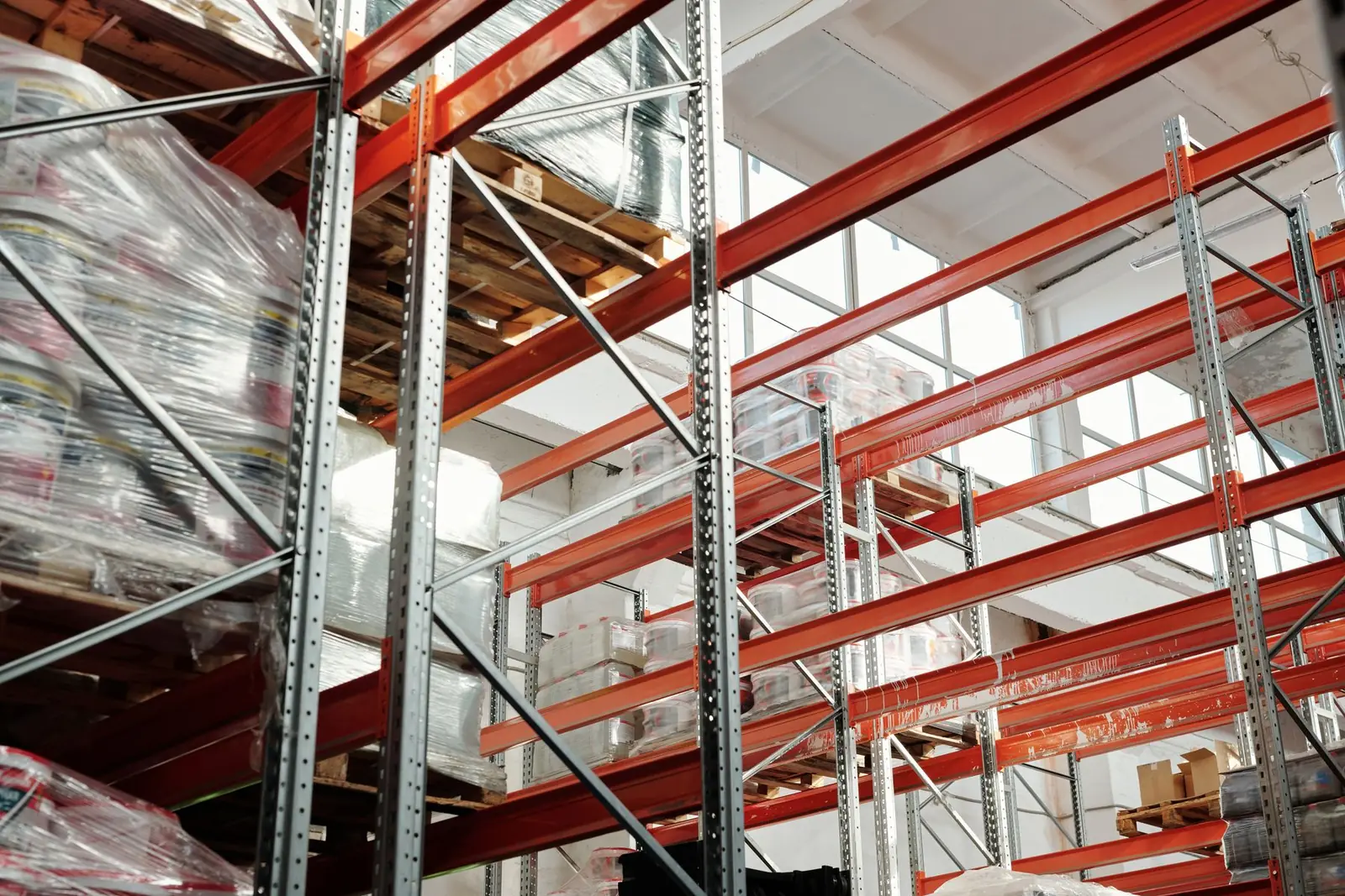 Bright warehouse with storage racks and pallets
